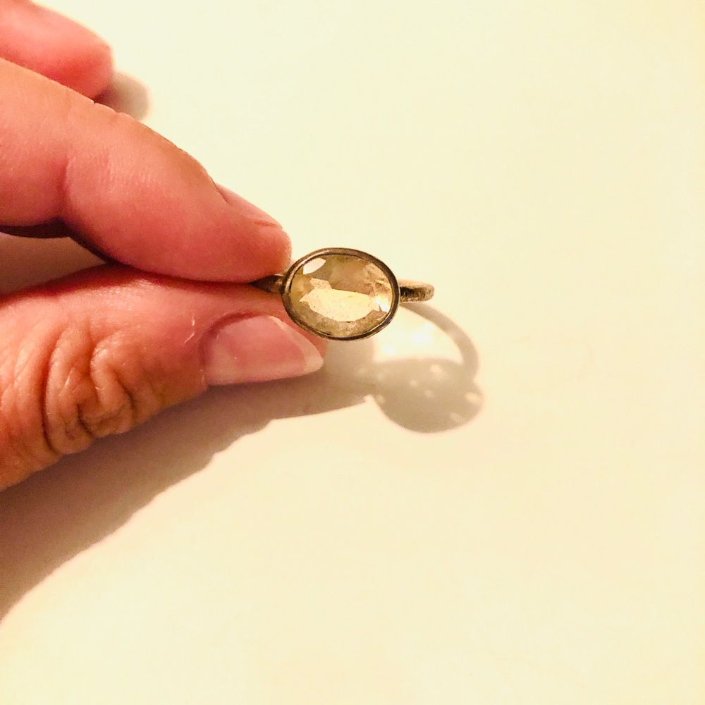 Gold ring with yellow jewel